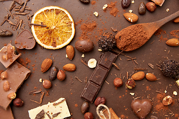 Image showing cocoa beans, chocolate, nuts and cinnamon sticks