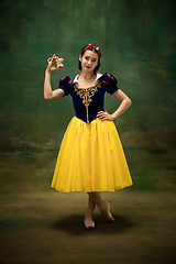 Image showing Young ballet dancer as a Snow White with poisoned apple in forest