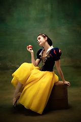 Image showing Young ballet dancer as a Snow White with poisoned apple in forest