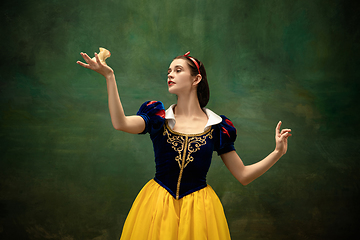 Image showing Young ballet dancer as a Snow White with poisoned apple in forest