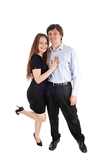 Image showing Happy young couple standing in dress and pants