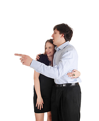 Image showing Young couple standing, man is pointing