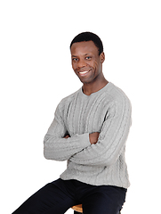 Image showing Happy African man smiling, sitting