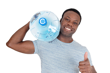 Image showing Smiling African man delivering fresh water