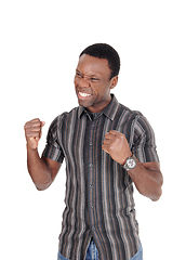 Image showing Happy African man making fists, smiling