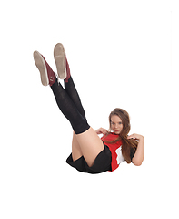 Image showing Young woman lying on the floor, legs up