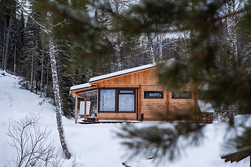 Image showing Winter holiday house in forest.