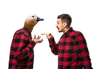 Image showing Man arguing with himself as a goose on white studio background.