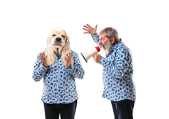 Image showing Senior man arguing with himself as a dog on white studio background.