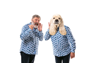 Image showing Senior man arguing with himself as a dog on white studio background.