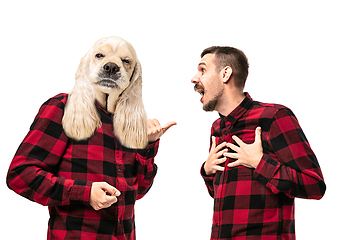 Image showing Man arguing with himself as a dog on white studio background.