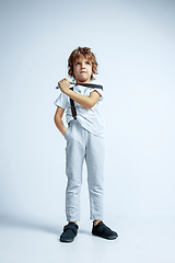 Image showing Pretty young boy in casual clothes on white studio background