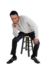 Image showing African man sitting on chair and thinking