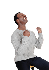 Image showing Happy African man with fists looking up