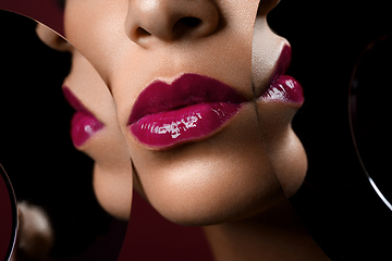 Image showing beautiful woman lips closeup with mirror reflections