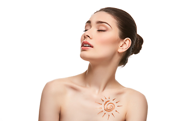 Image showing girl with sun drawing on forehead isolated on white