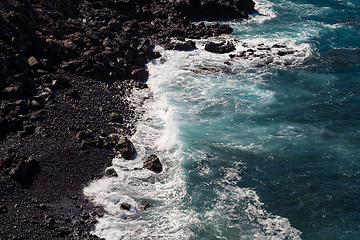 Image showing beautiful view on ocean water and black lava sand