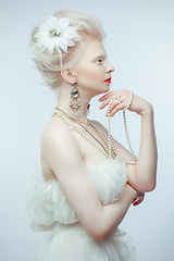 Image showing beautiful albino girl with red lips on white background