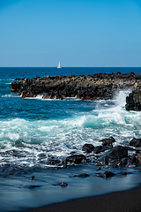 Image showing beautiful view on ocean water and black lava sand