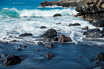 Image showing beautiful view on ocean water and black lava sand