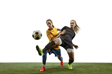 Image showing Female soccer players practicing and training at the stadium