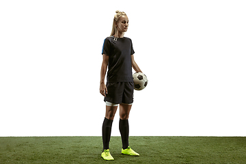 Image showing Female soccer player practicing and training at the stadium