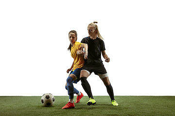 Image showing Female soccer players practicing and training at the stadium