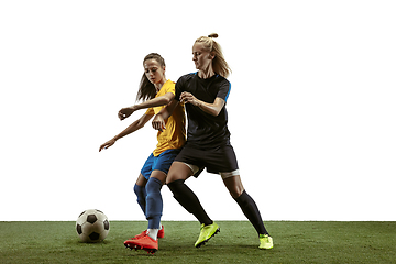 Image showing Female soccer players practicing and training at the stadium