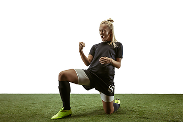 Image showing Female soccer player practicing and training at the stadium