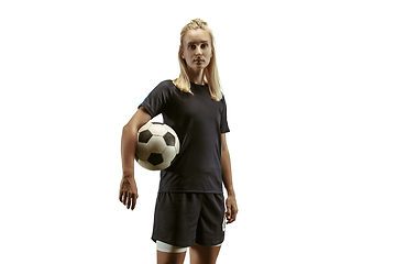 Image showing Female soccer player practicing and training at the stadium