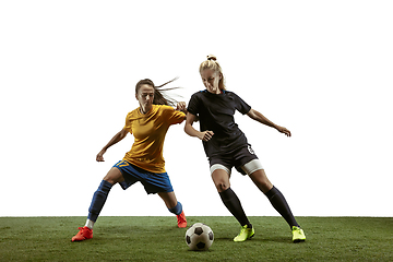 Image showing Female soccer players practicing and training at the stadium