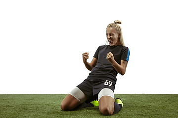 Image showing Female soccer player practicing and training at the stadium