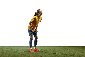 Image showing Female soccer player practicing and training at the stadium