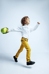 Image showing Pretty young boy in casual clothes on white studio background