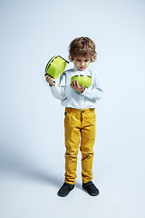 Image showing Pretty young boy in casual clothes on white studio background