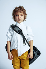 Image showing Pretty young boy in casual clothes on white studio background