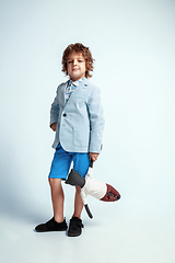 Image showing Pretty young boy in casual clothes on white studio background