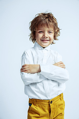 Image showing Pretty young boy in casual clothes on white studio background