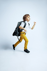 Image showing Pretty young boy in casual clothes on white studio background