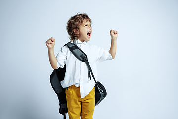 Image showing Pretty young boy in casual clothes on white studio background