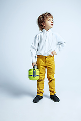 Image showing Pretty young boy in casual clothes on white studio background