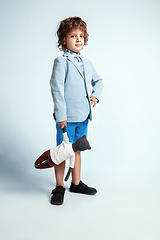 Image showing Pretty young boy in casual clothes on white studio background