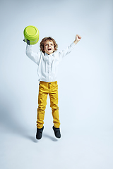 Image showing Pretty young boy in casual clothes on white studio background