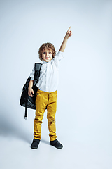 Image showing Pretty young boy in casual clothes on white studio background