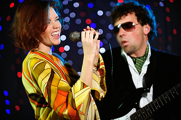 Image showing Female singer and male guitar player