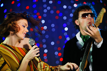 Image showing Female singer and male guitar player