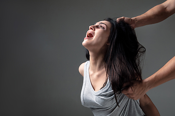 Image showing Woman being under domestic abuse and violence, concept of female rights