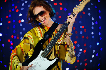 Image showing Female guitar player