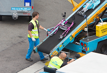 Image showing AMSTERDAM, NETHERLANDS - JUNE 29, 2017: Loading luggage in airpl