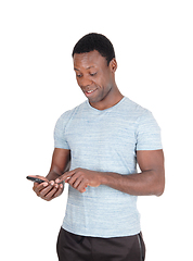 Image showing Man looking surprised at his phone
